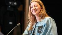 Female student speaking in front of the podium at Class Day