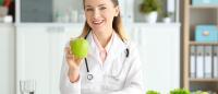 Physician holding an apple