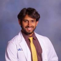 Photo of Zarrar Nashman in his white coat.